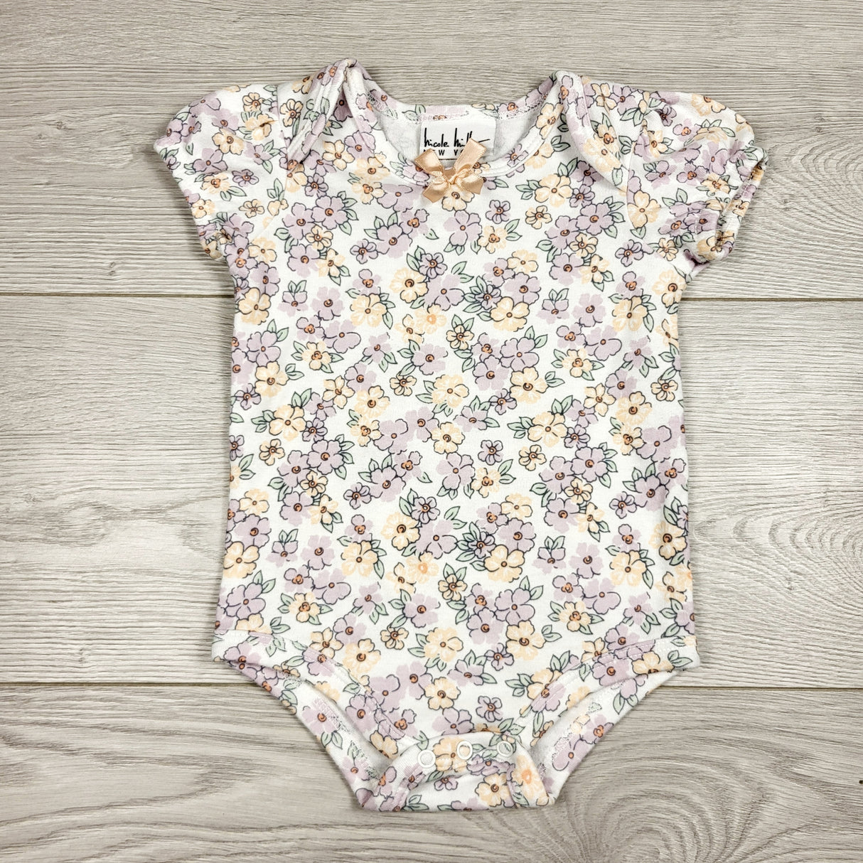 CCAM1 - Nicole Miller floral print bodysuit. Size 6-9 months