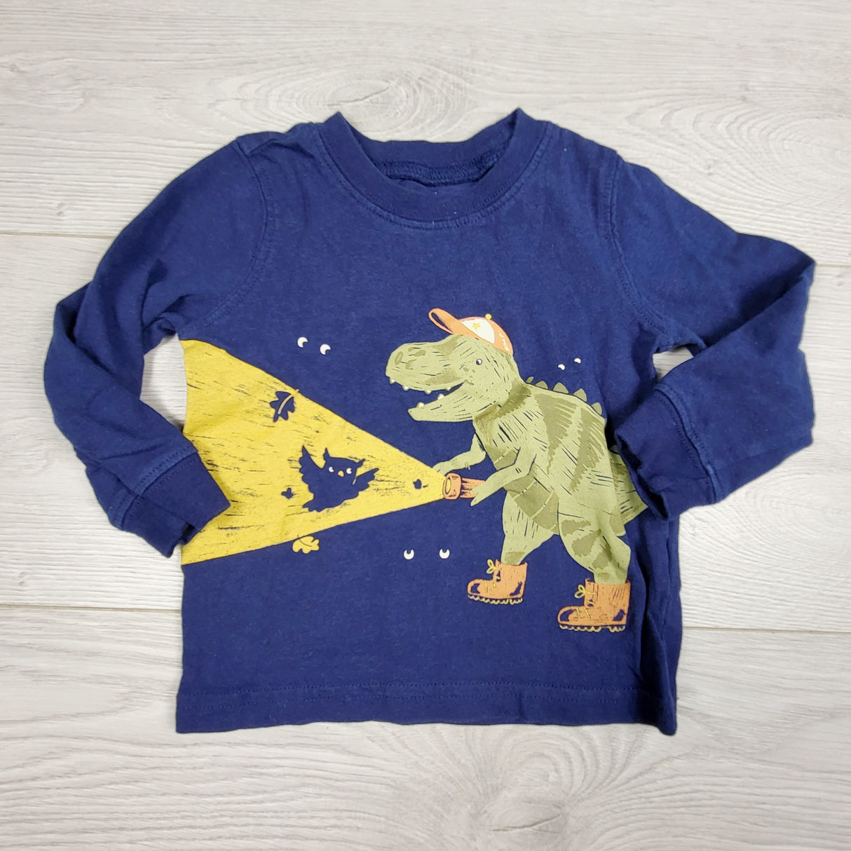 CHSP22 - Carters navy top with T-Rex with flashlight. Size 12 months