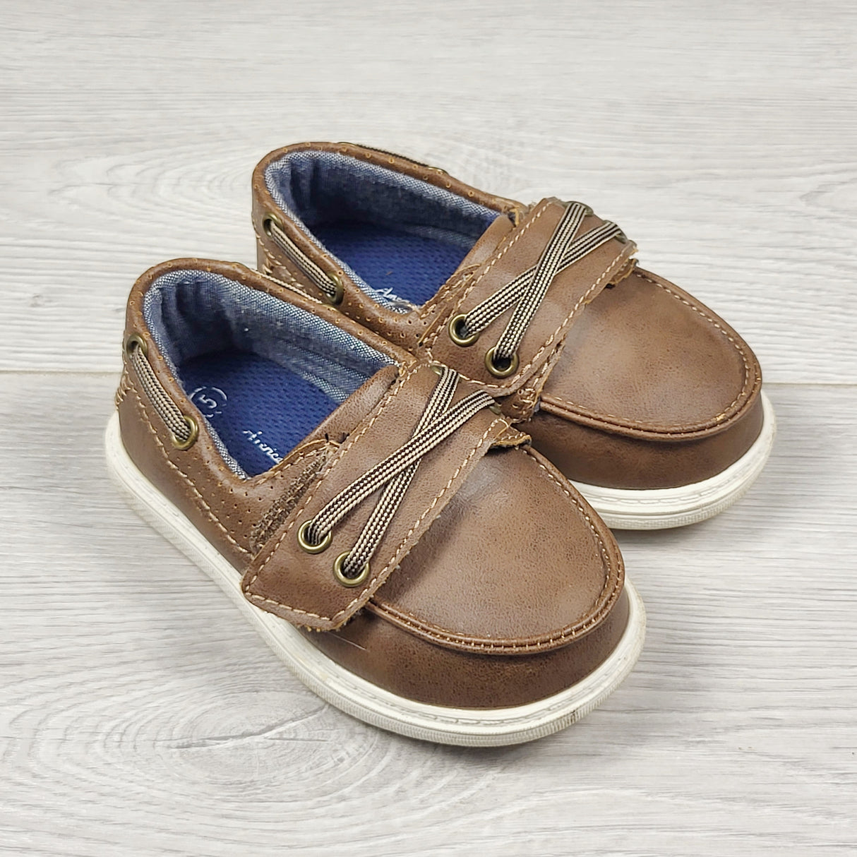 CBEN1 - American Eagle brown slip on boat style shoe. Size 5