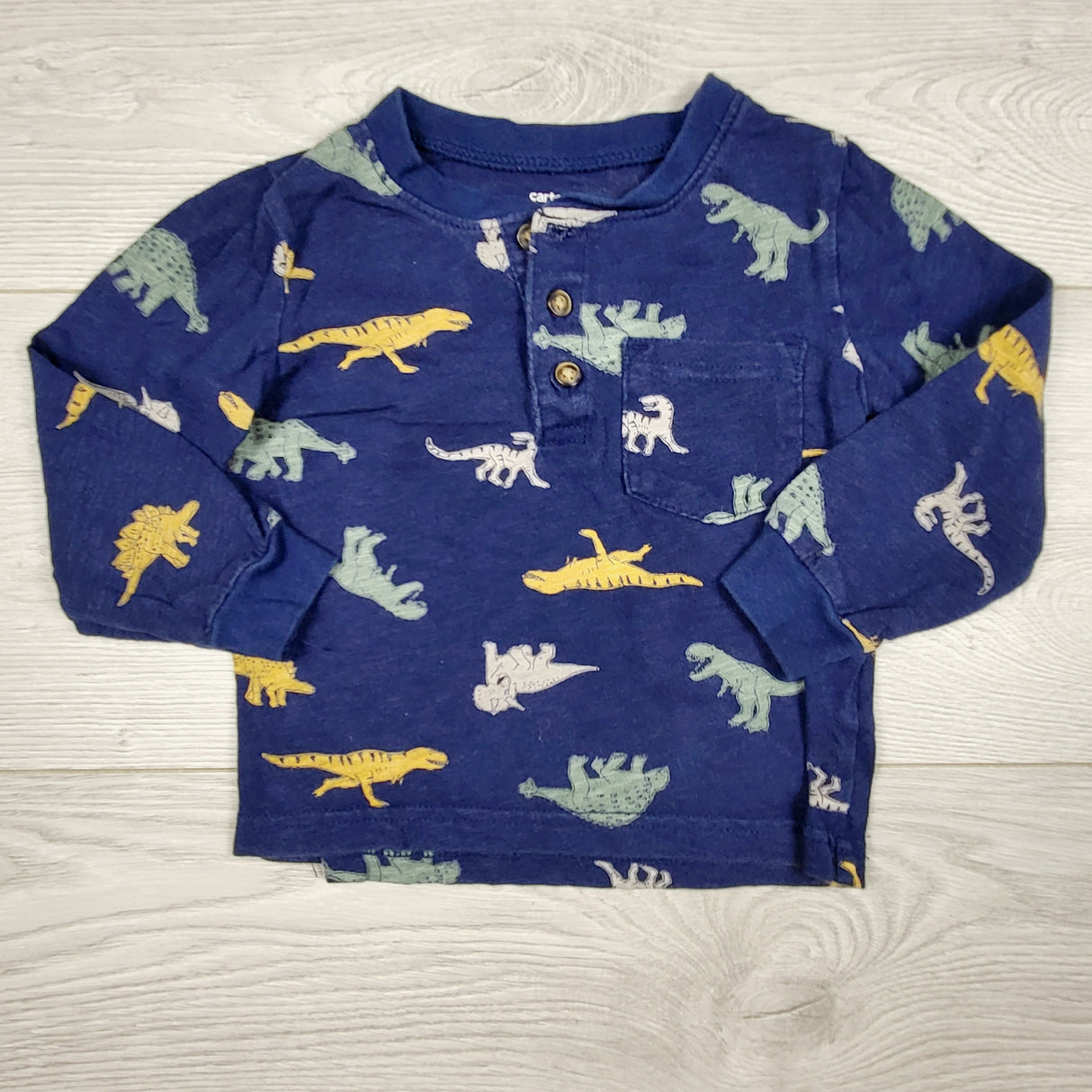 CBEN1 - Carters navy long sleeved dinosaur shirt. Size 18 months