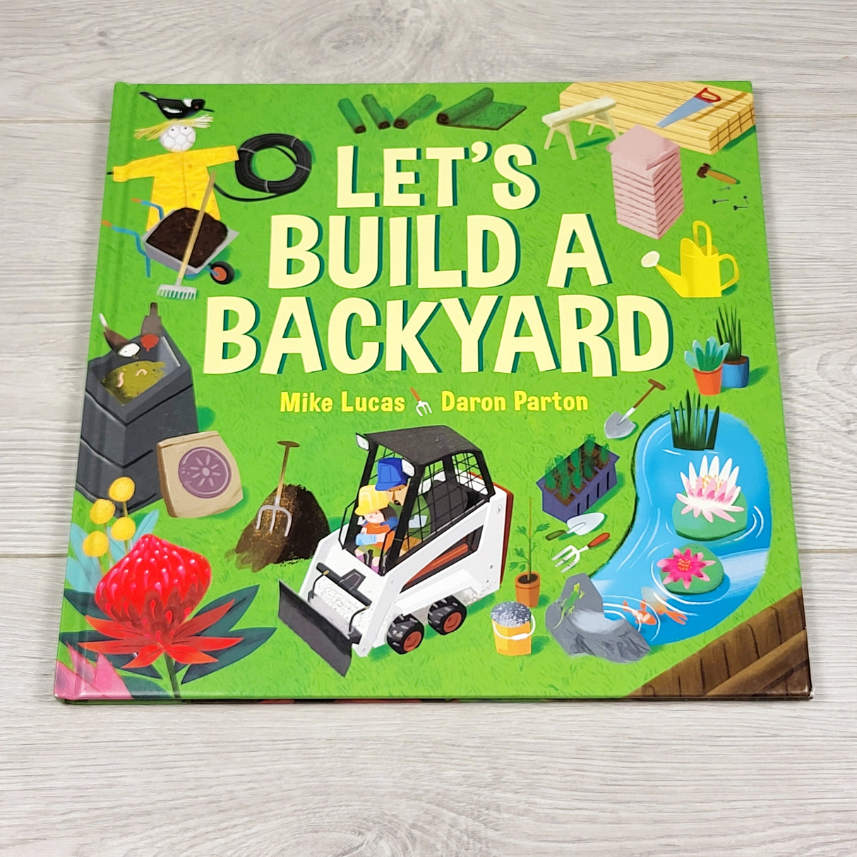 KMIL1 - Let's Build a Backyard. Hardcover book