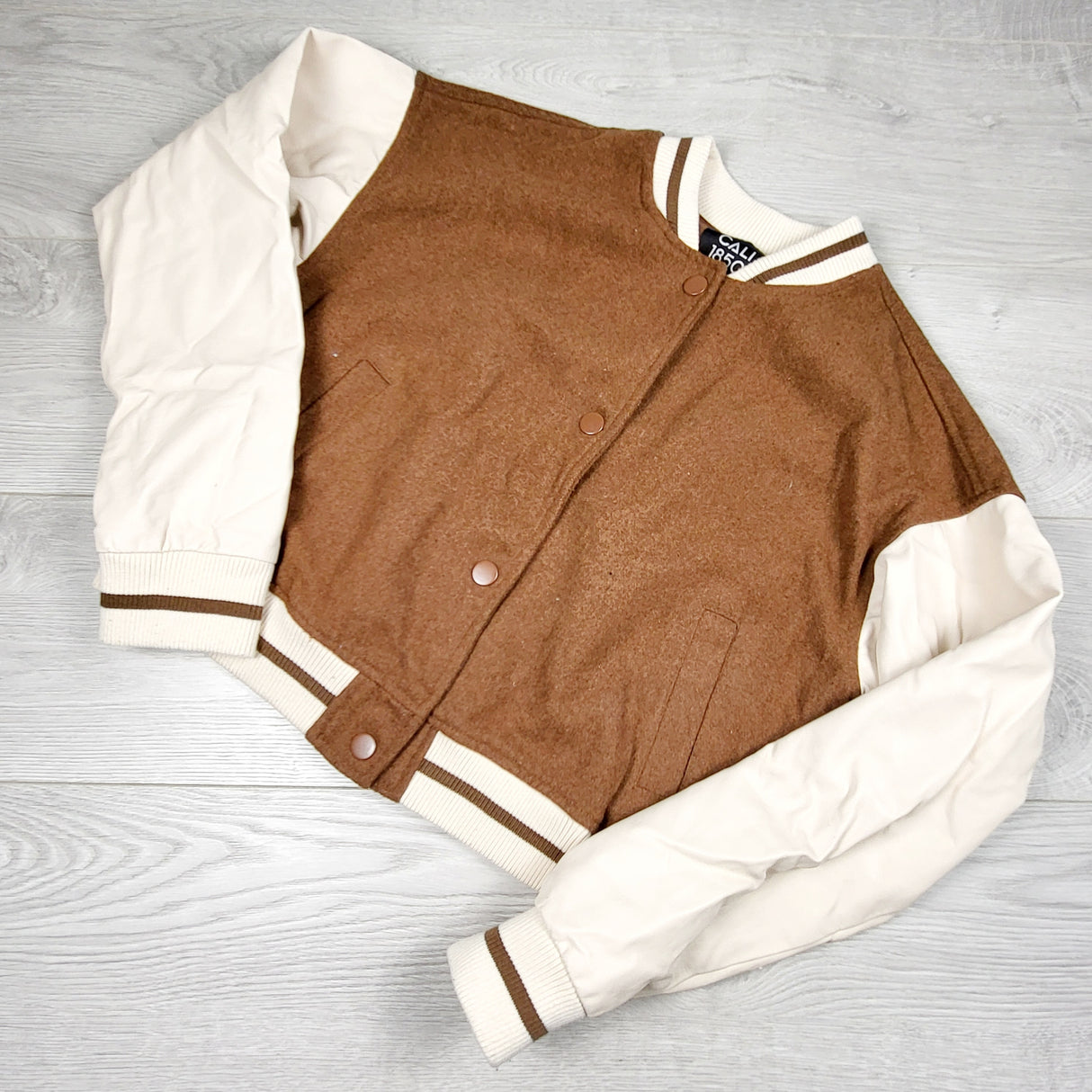KTBL1 - Cali 1850 cream and tan faux leather bombr jacket. ADULT size small