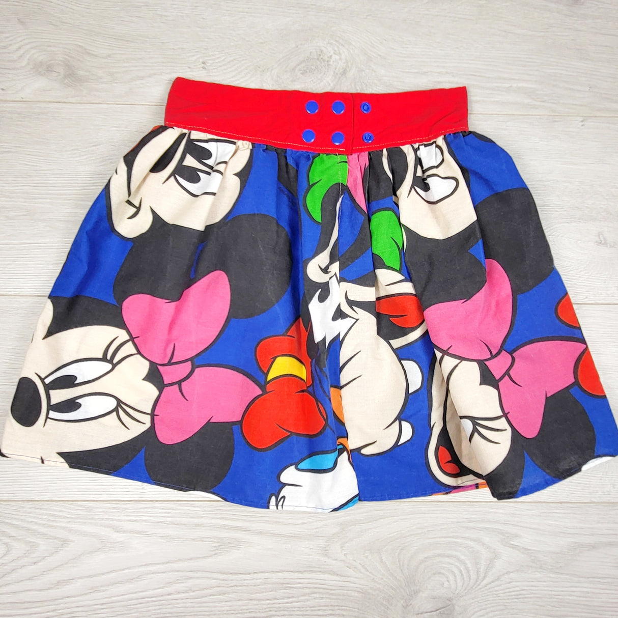 KTBL1 - Custom made blue Minnie Mouse skirt with 3 snap positions. Approx 6-10 years