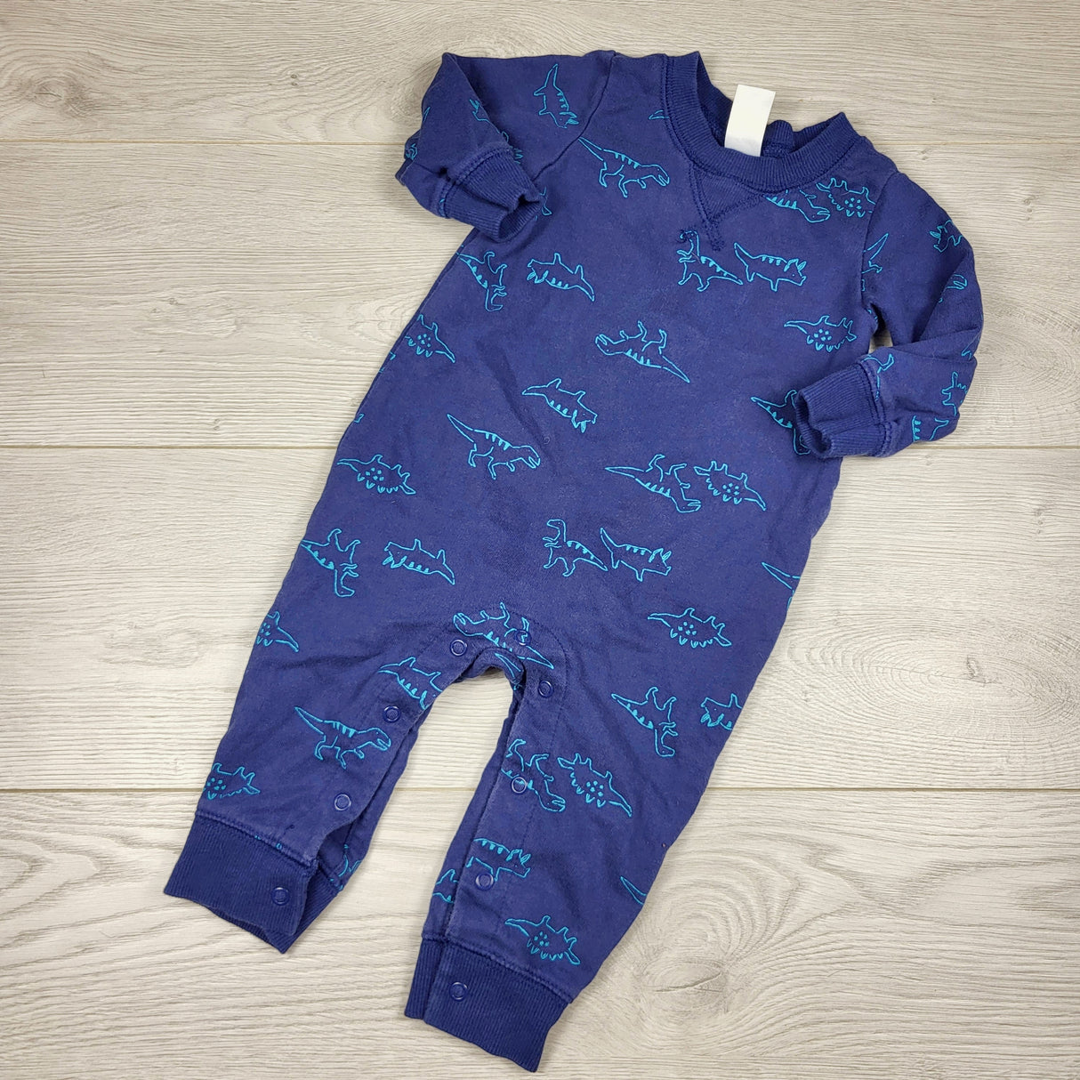 DOKN1 - Carters navy romper with dinosaurs. Size 9 months