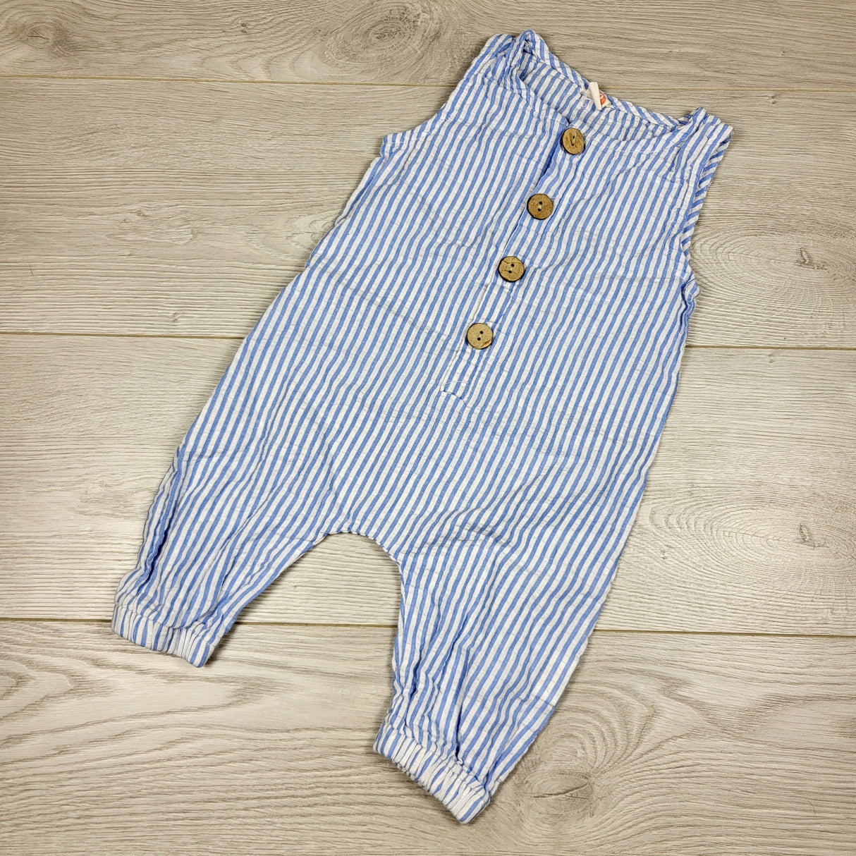 DOKN1 - Blue vertical striped romper. Size 6-12 months