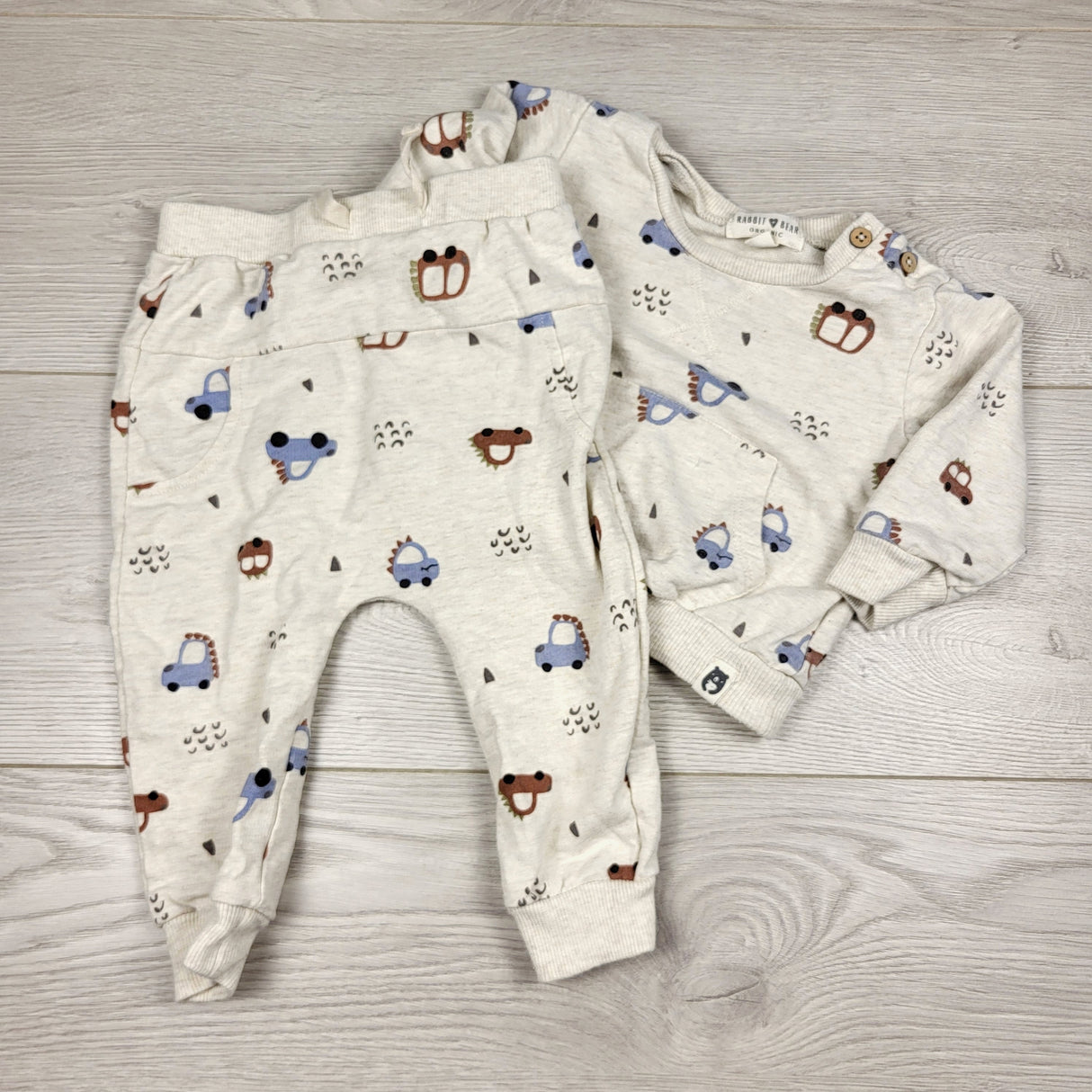 DOKN1 - Rabbit + Bear beige 2pc set with dinosaur cars. Size 6-9 months