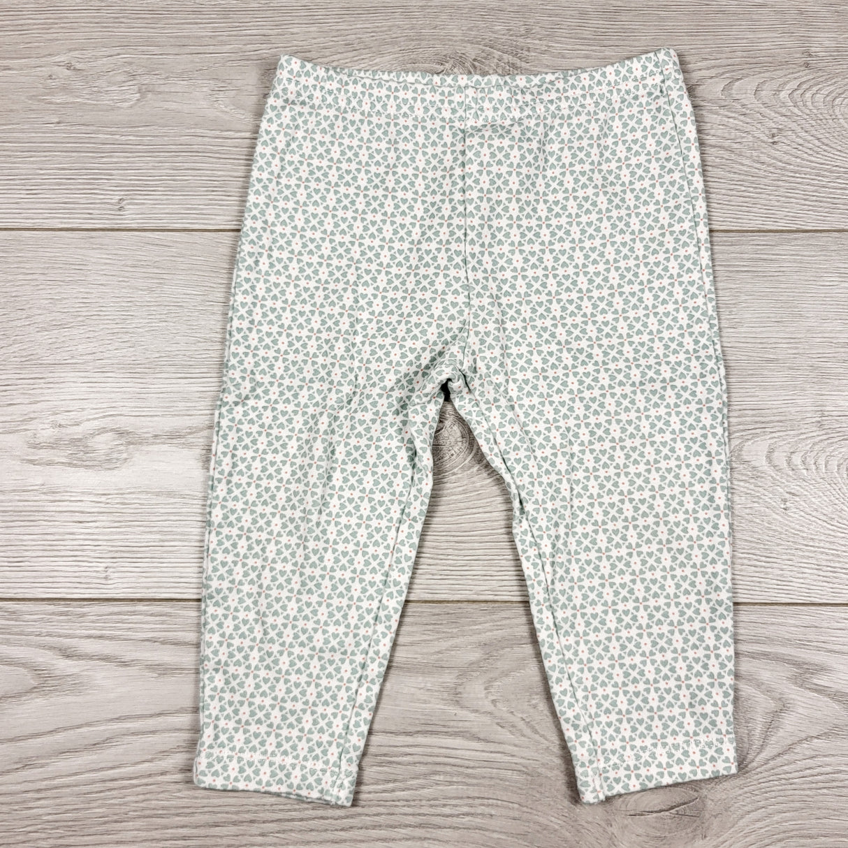 MWLL3 - Child of Mine leggings with pale green hearts. Size 12 months