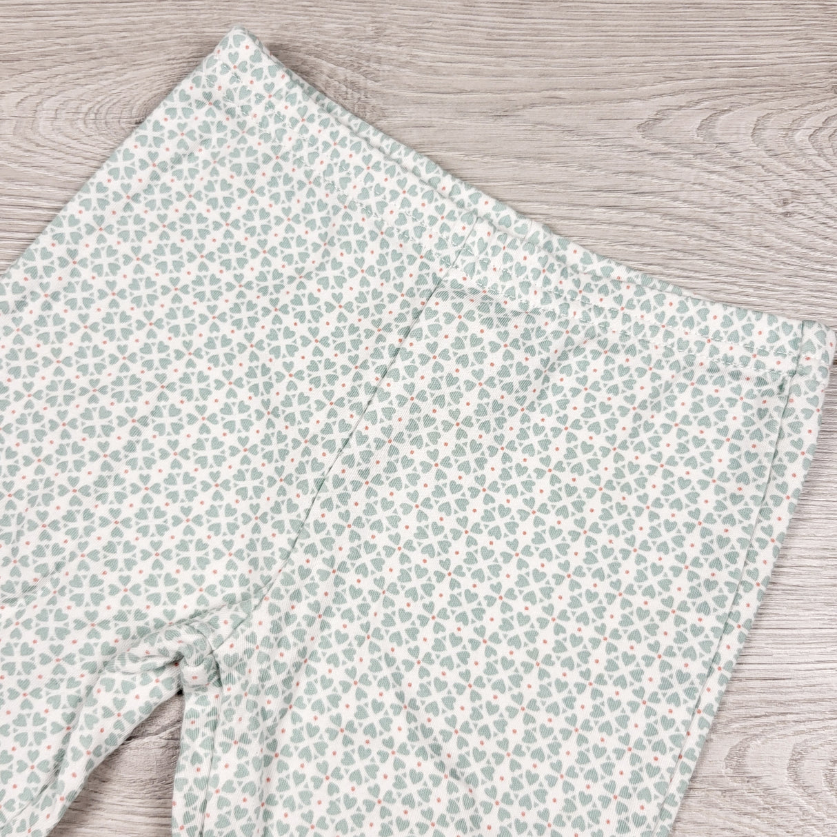 MWLL3 - Child of Mine leggings with pale green hearts. Size 12 months