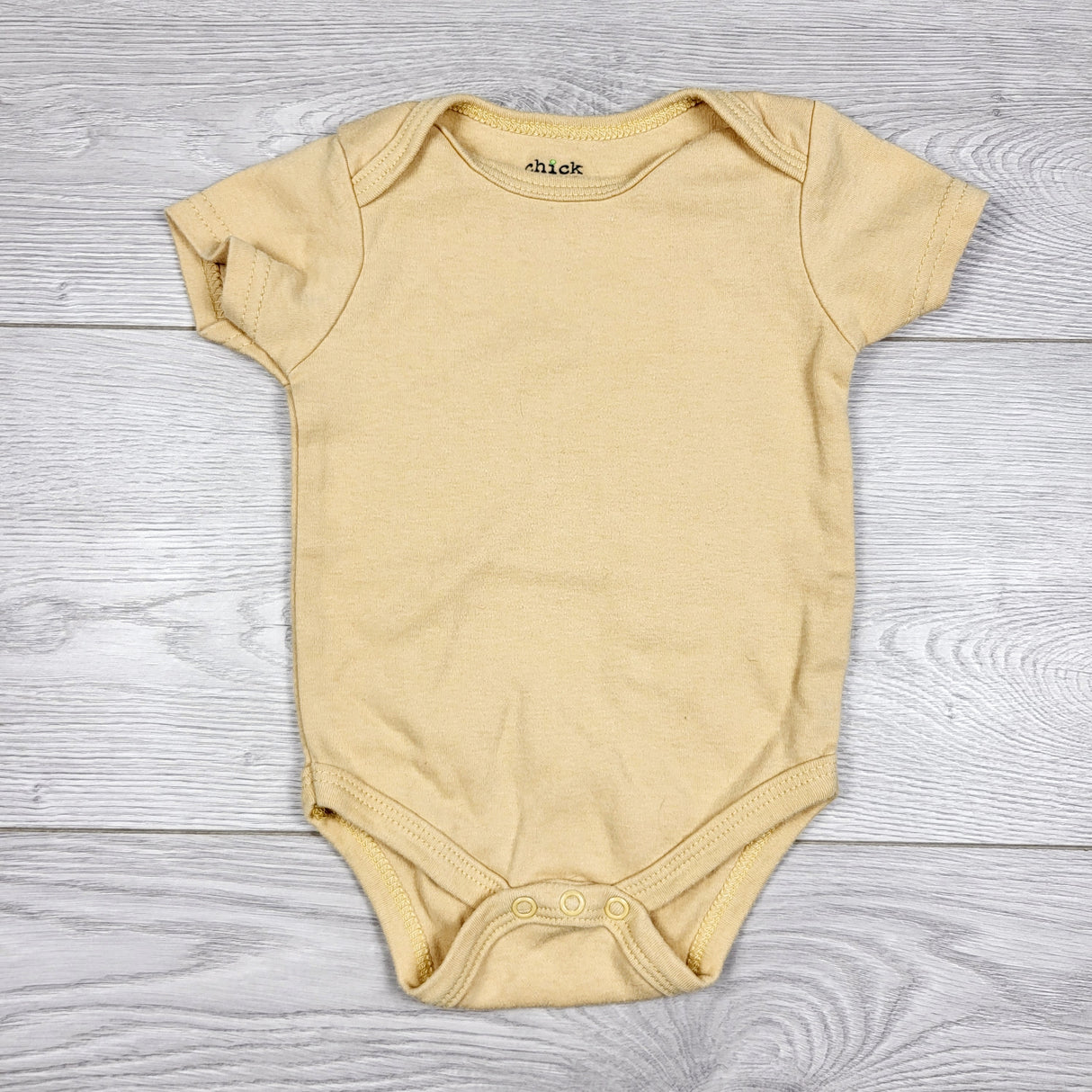 AMST3 - Chick Pea yellow bodysuit. Size 6-9 months