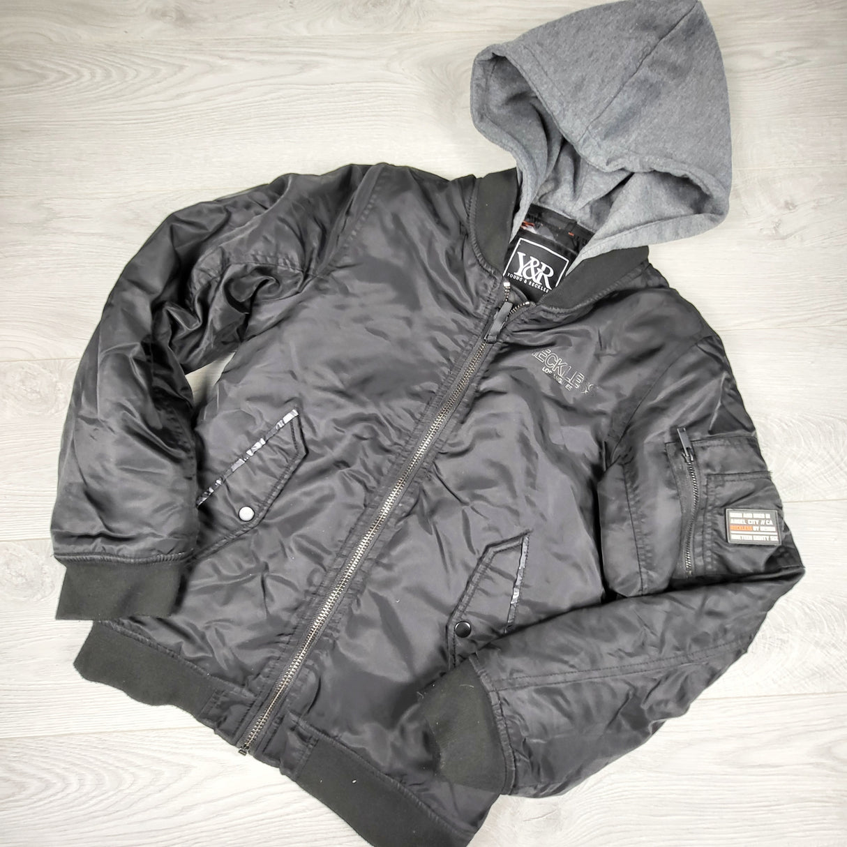 OAG1 - Young and Reckless hooded water resistant jacket. Size 14