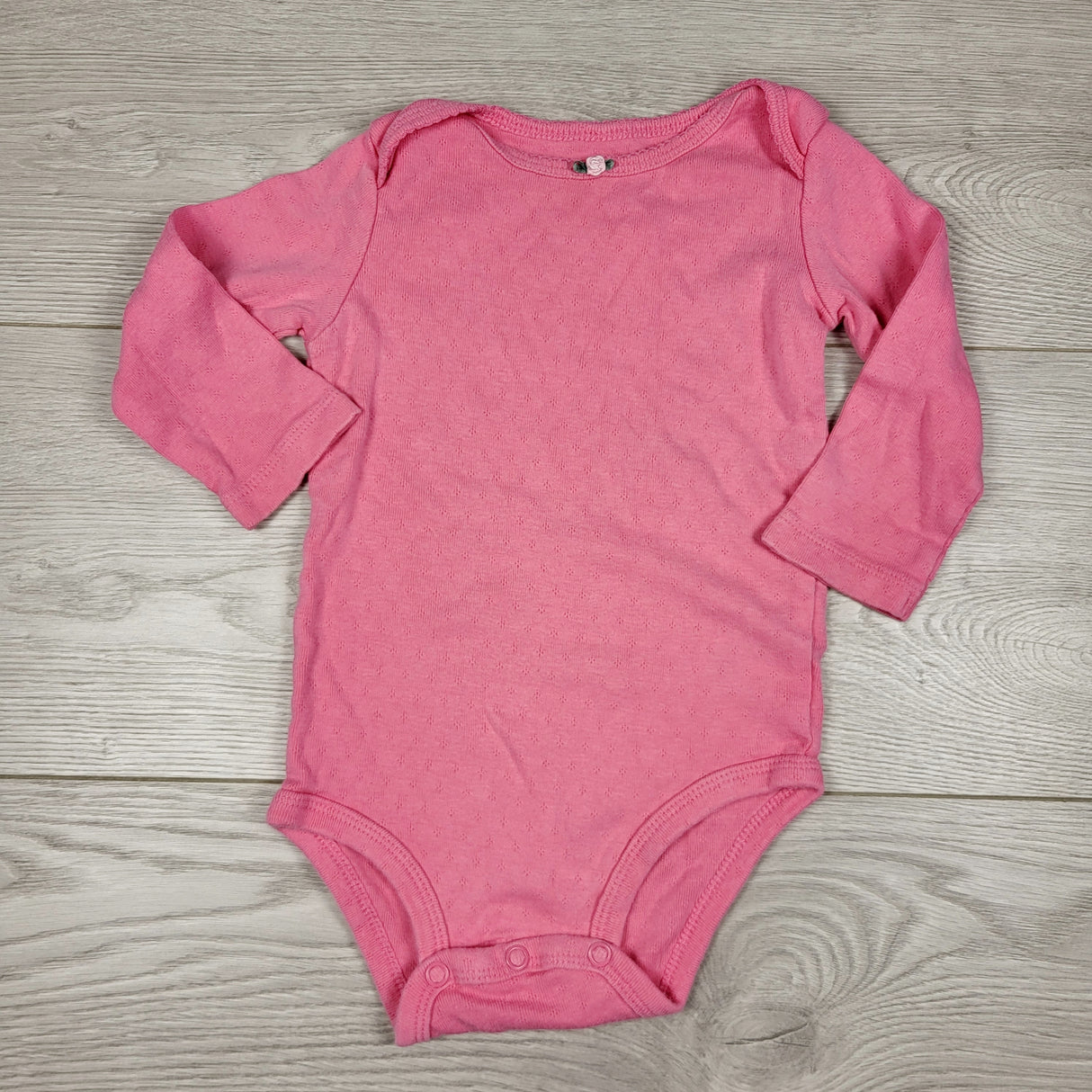 MWLL4 - Carters solid pink bodysuit. Size 9 months