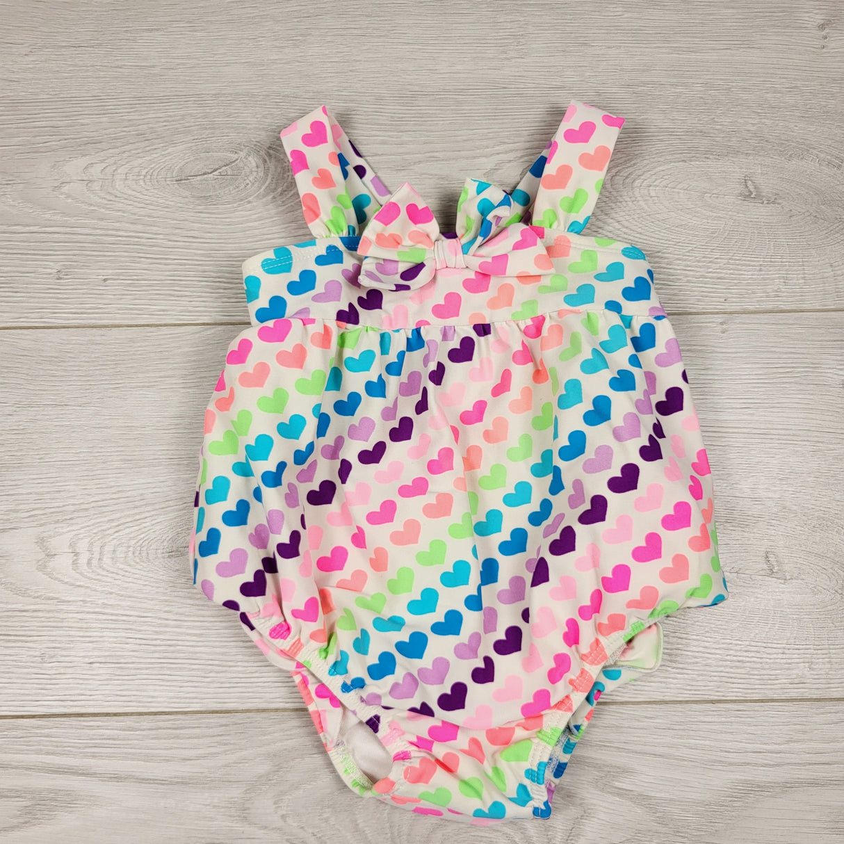KAMG11 - Children's Place one piece swimsuit with hearts (built in diaper cover). Size 12 months