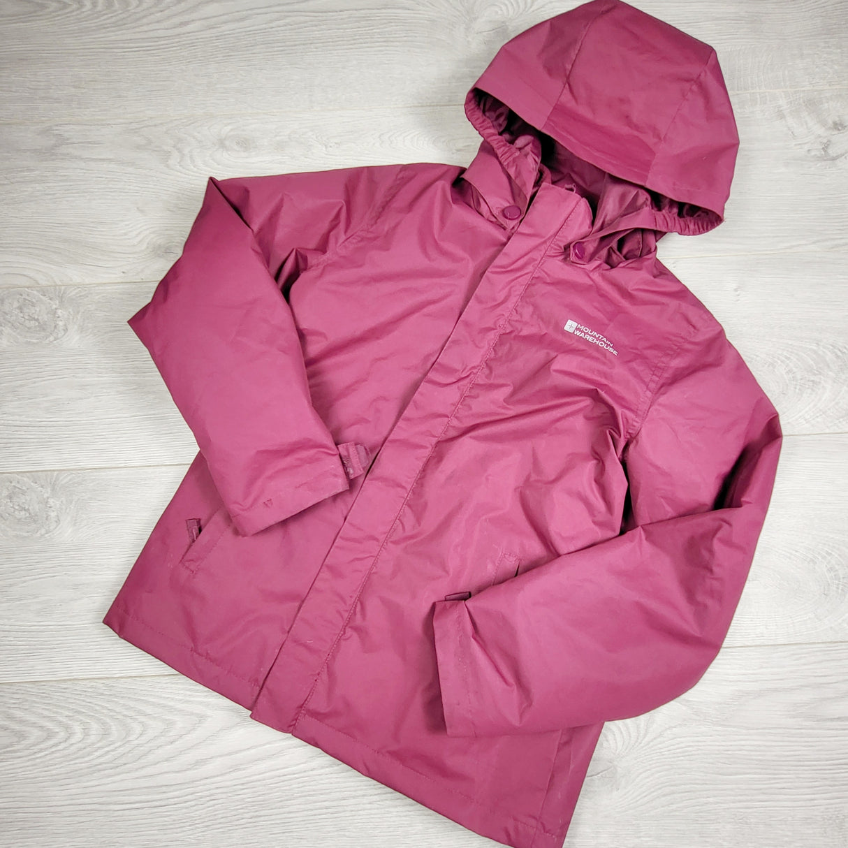 DLJ1 - Mountain Warehouse pink rain jacket with zip out fleece. Size 9 years