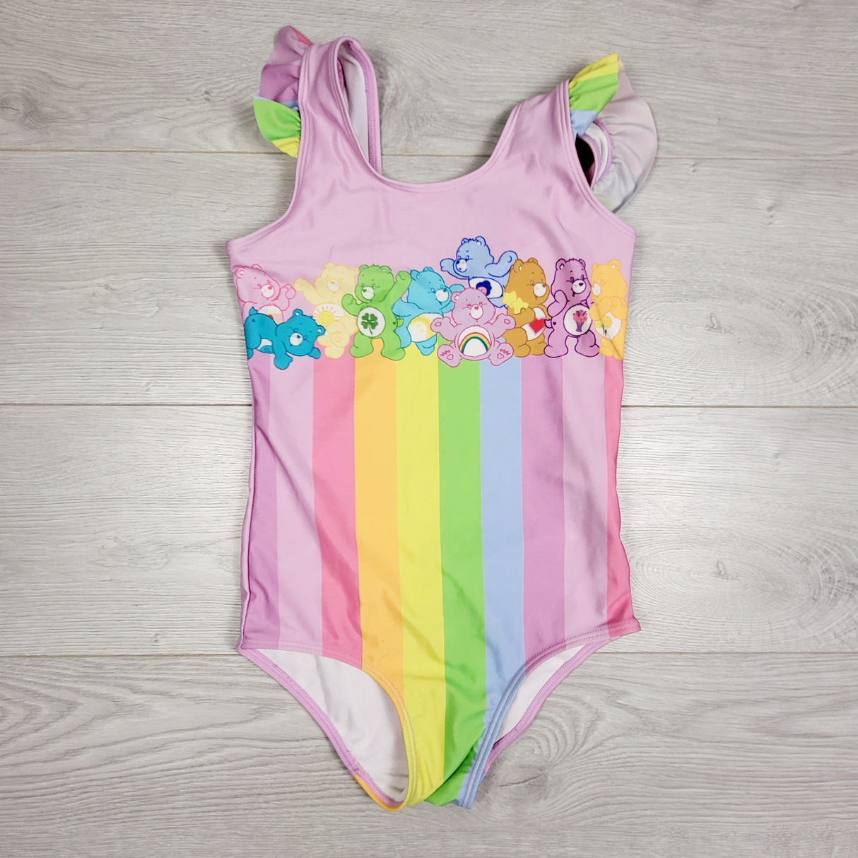 DLJ2 - H and M Care Bears one piece swimsuit. Size 8-10 Years