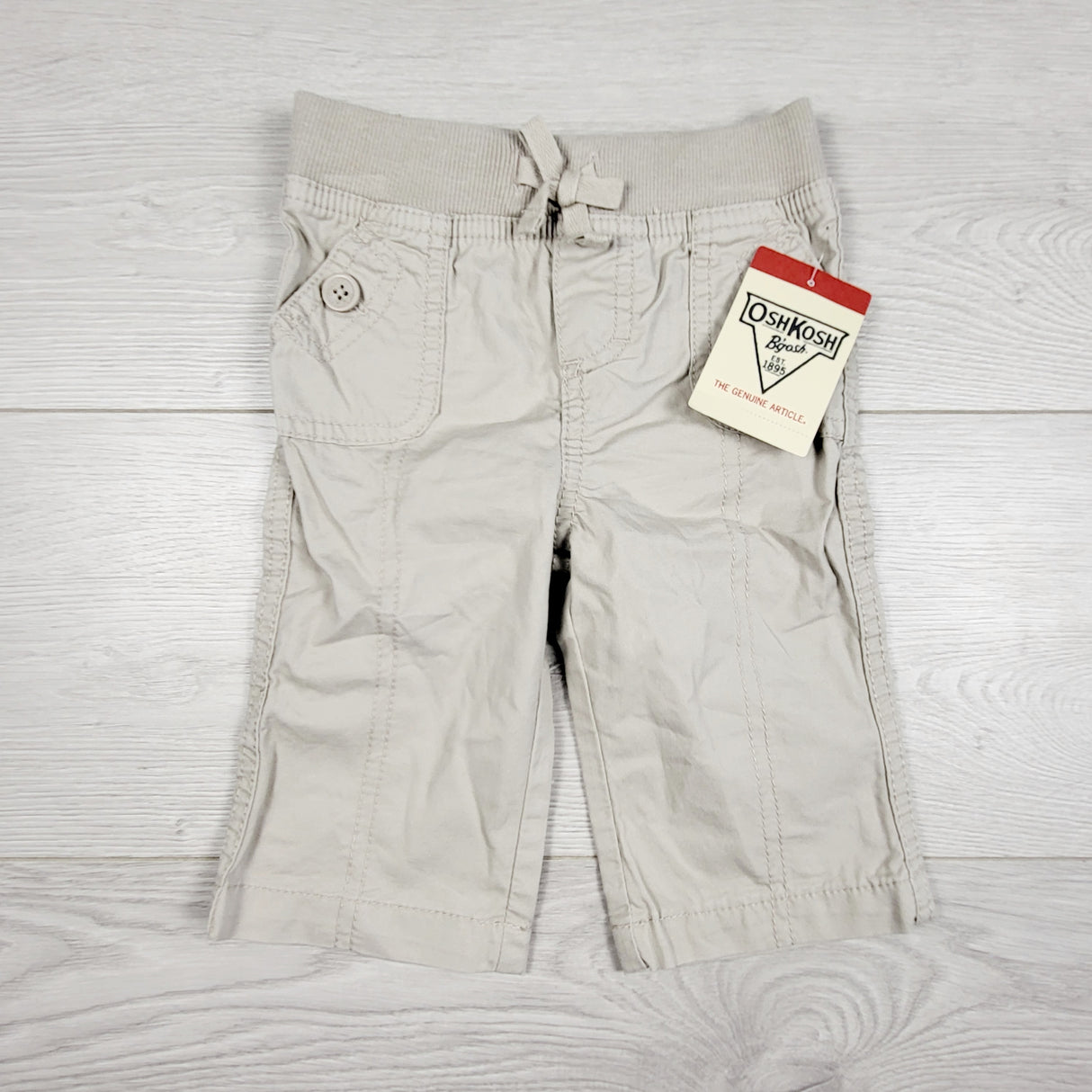 KAMG22 - NEW - Oshkosh pull on khaki pants. Size 6 months