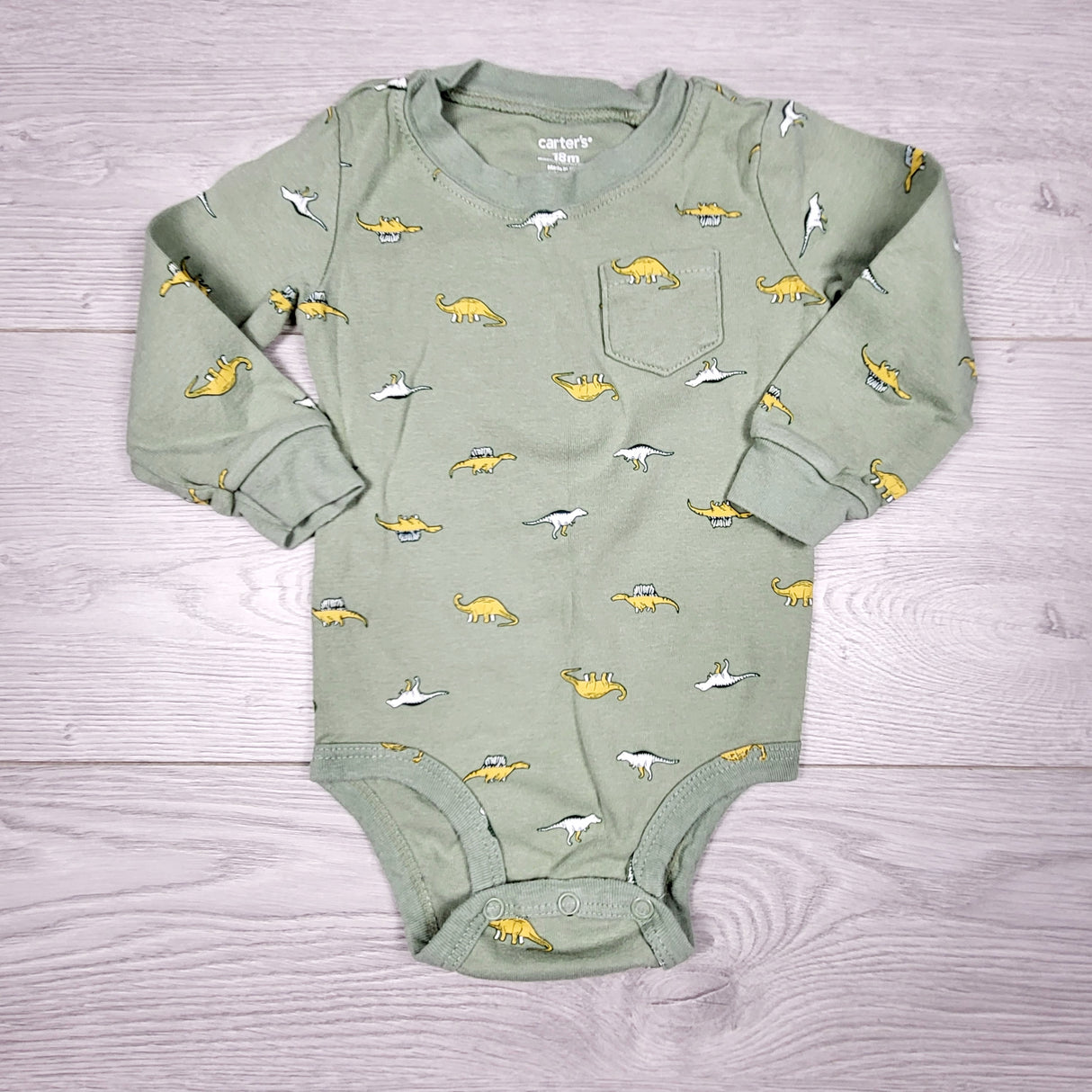 KRML1 - Carters green bodysuit with dinosaurs. Size 18 months