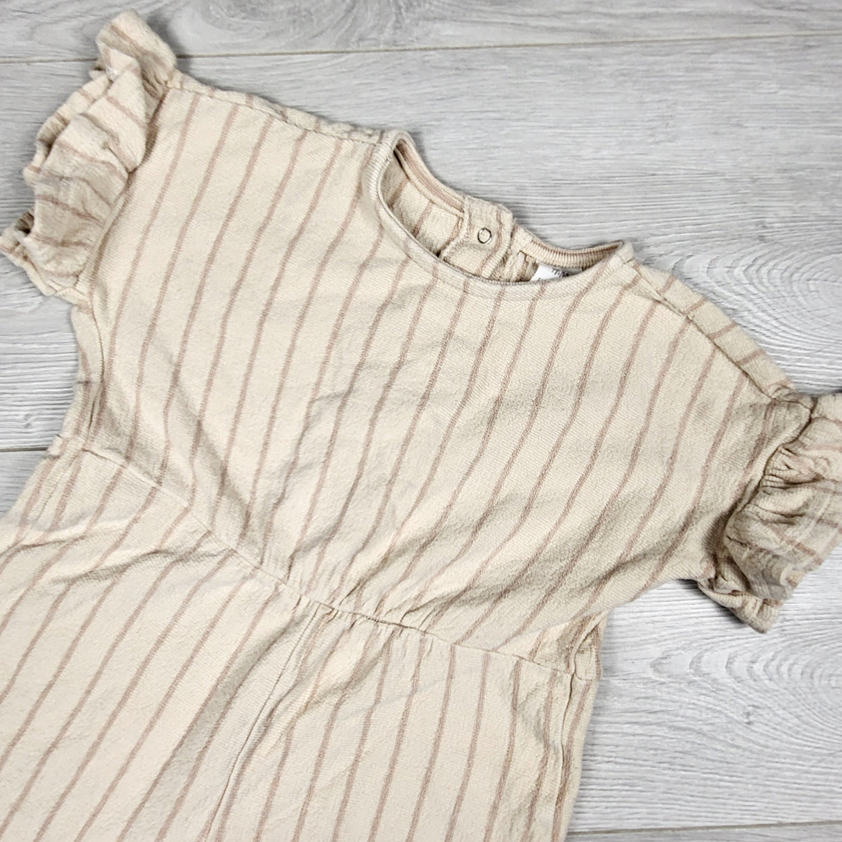 DMKY2- H and M beige striped jumpsuit. Size 12-18 months