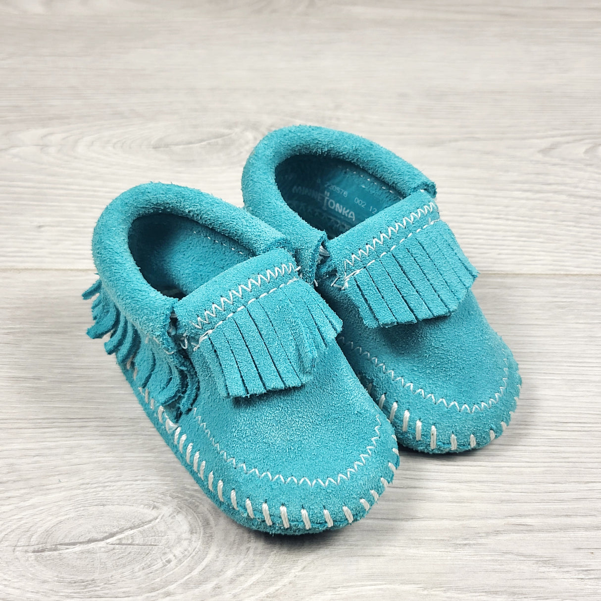 Minnetonka turquoise suede "Riley" booties. Newborn size