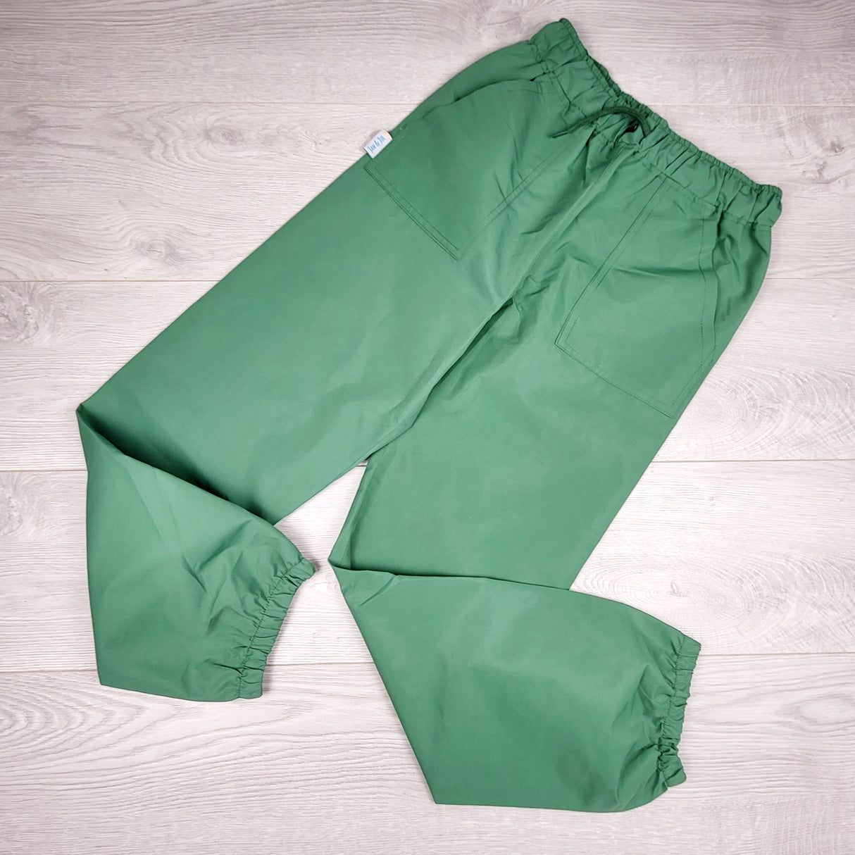Jan and Jul green single layer rain pants. Size 10
