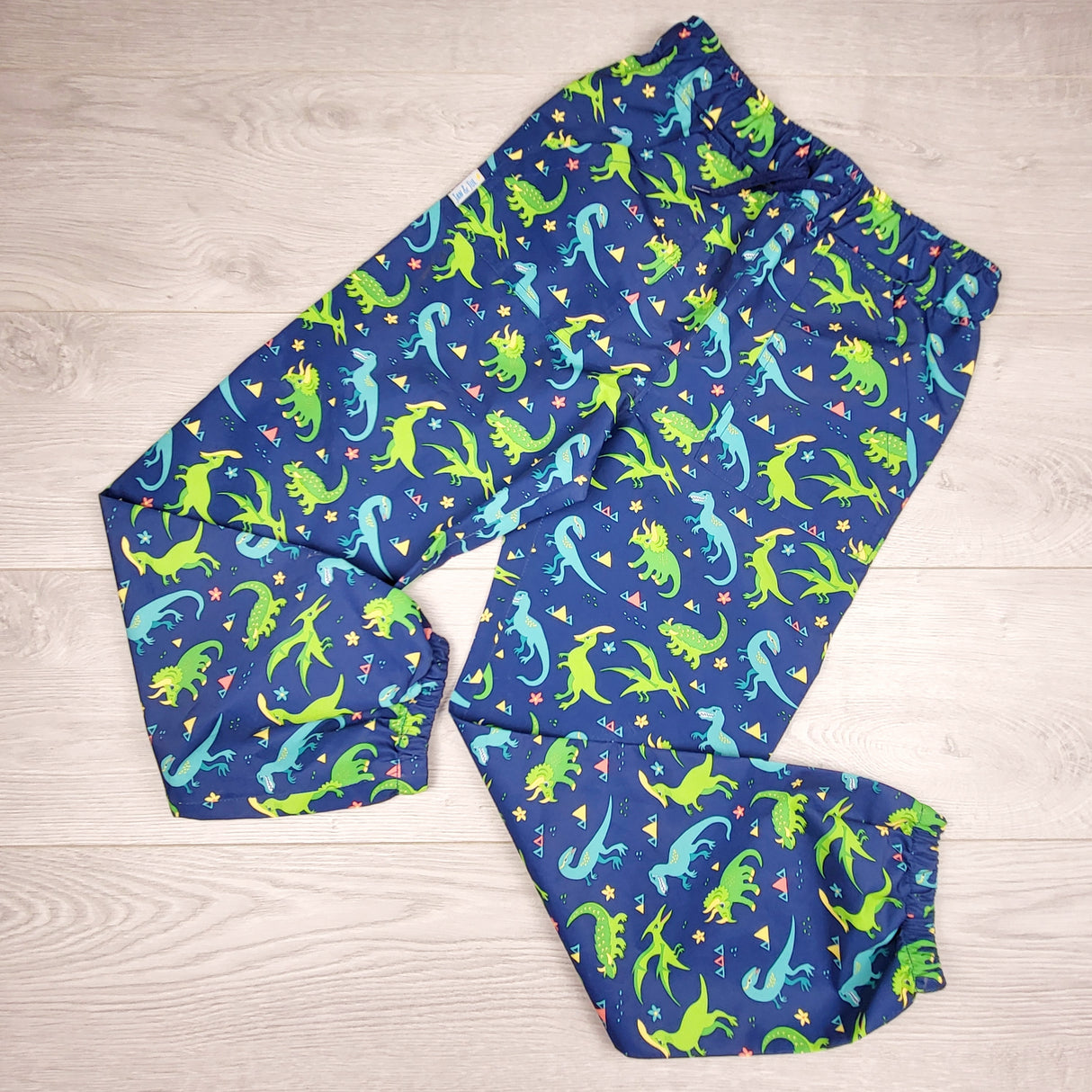 Jan and Jul navy dinosaur patterned single layer rain pants. Size like an 8