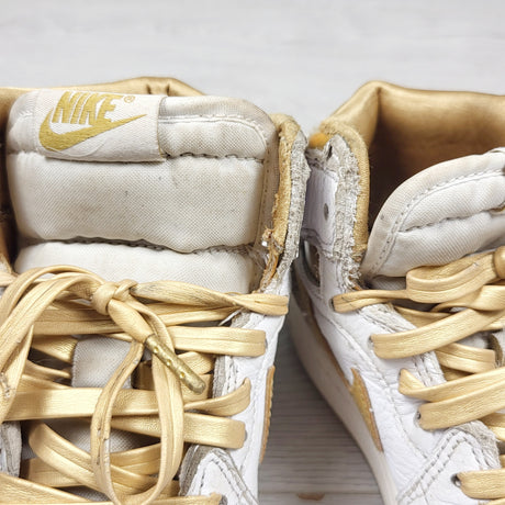 Nike white and gold retro Air Jordan 1 hightop sneakers. Youth size 2