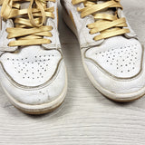 Nike white and gold retro Air Jordan 1 hightop sneakers. Youth size 2