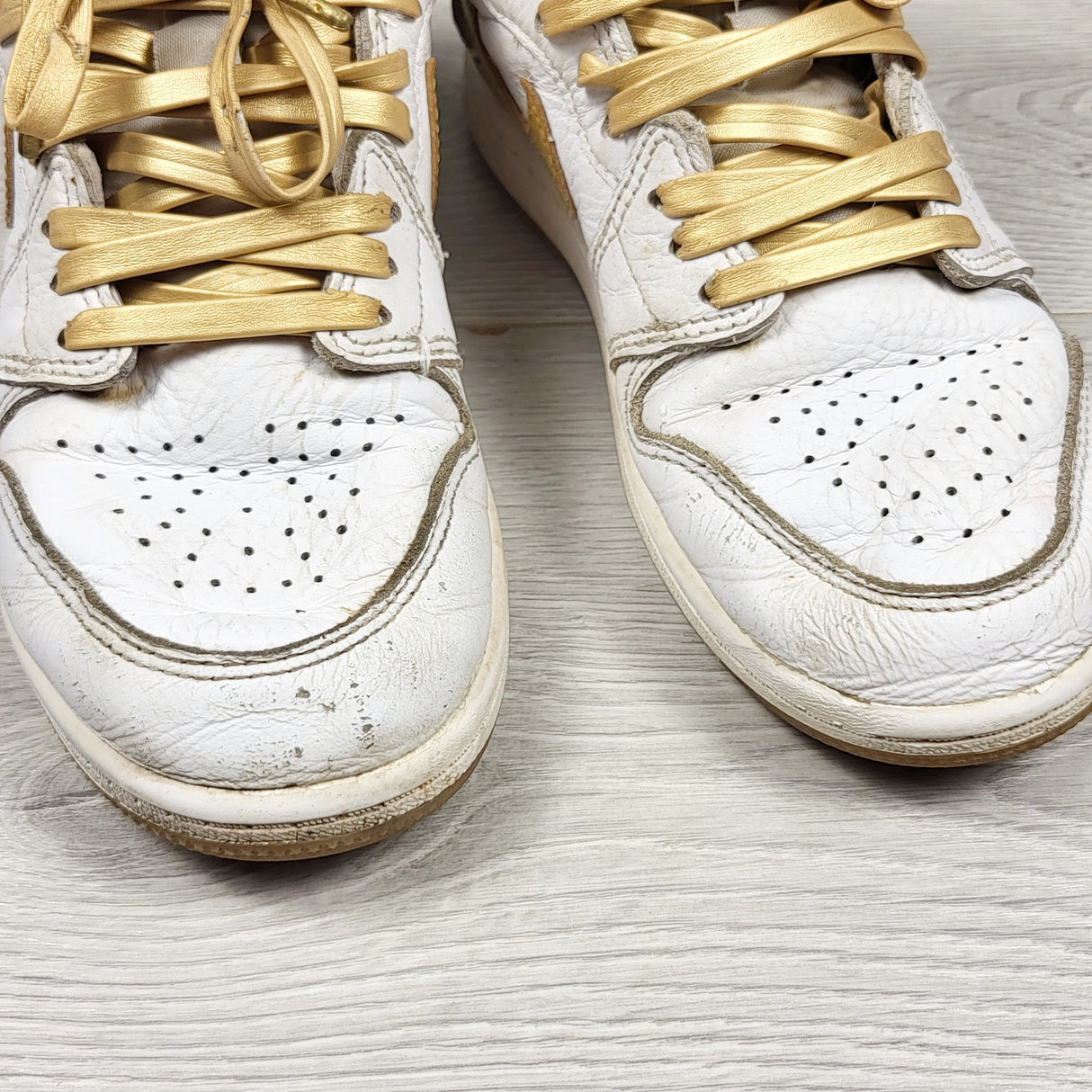 Nike white and gold retro Air Jordan 1 hightop sneakers. Youth size 2