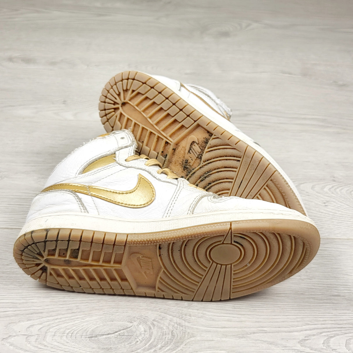 Nike white and gold retro Air Jordan 1 hightop sneakers. Youth size 2