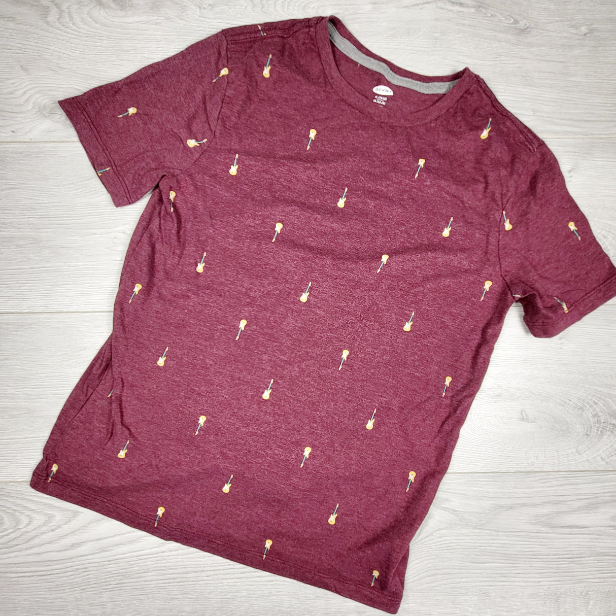 Old Navy plum colured t-shirt with guitars. Size 14/16
