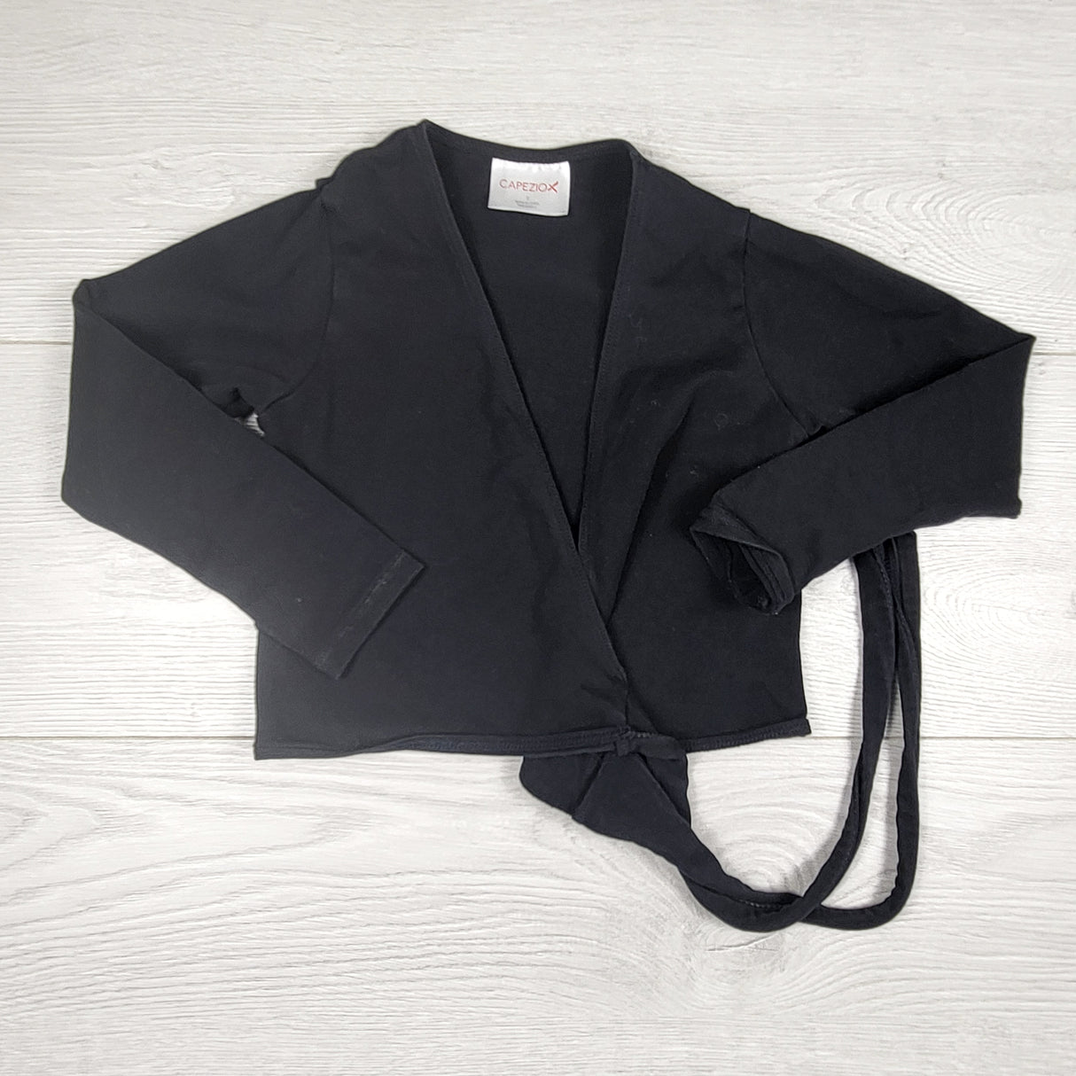 Capezio black long sleeve wrap top. Looks like a 4T