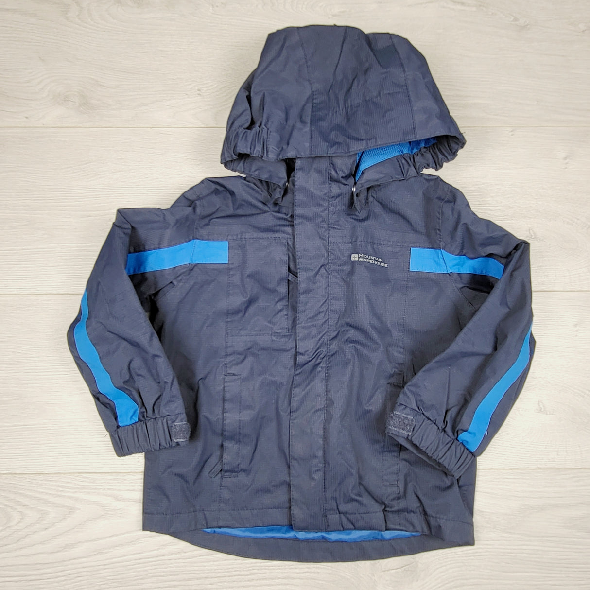 Mountain Warehouse navy hooded rain jacket. Size 2/3T