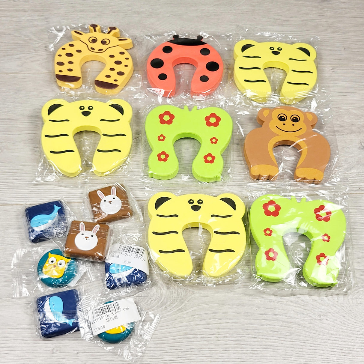 NEW - Lot of foam door pinch cards and door stoppers