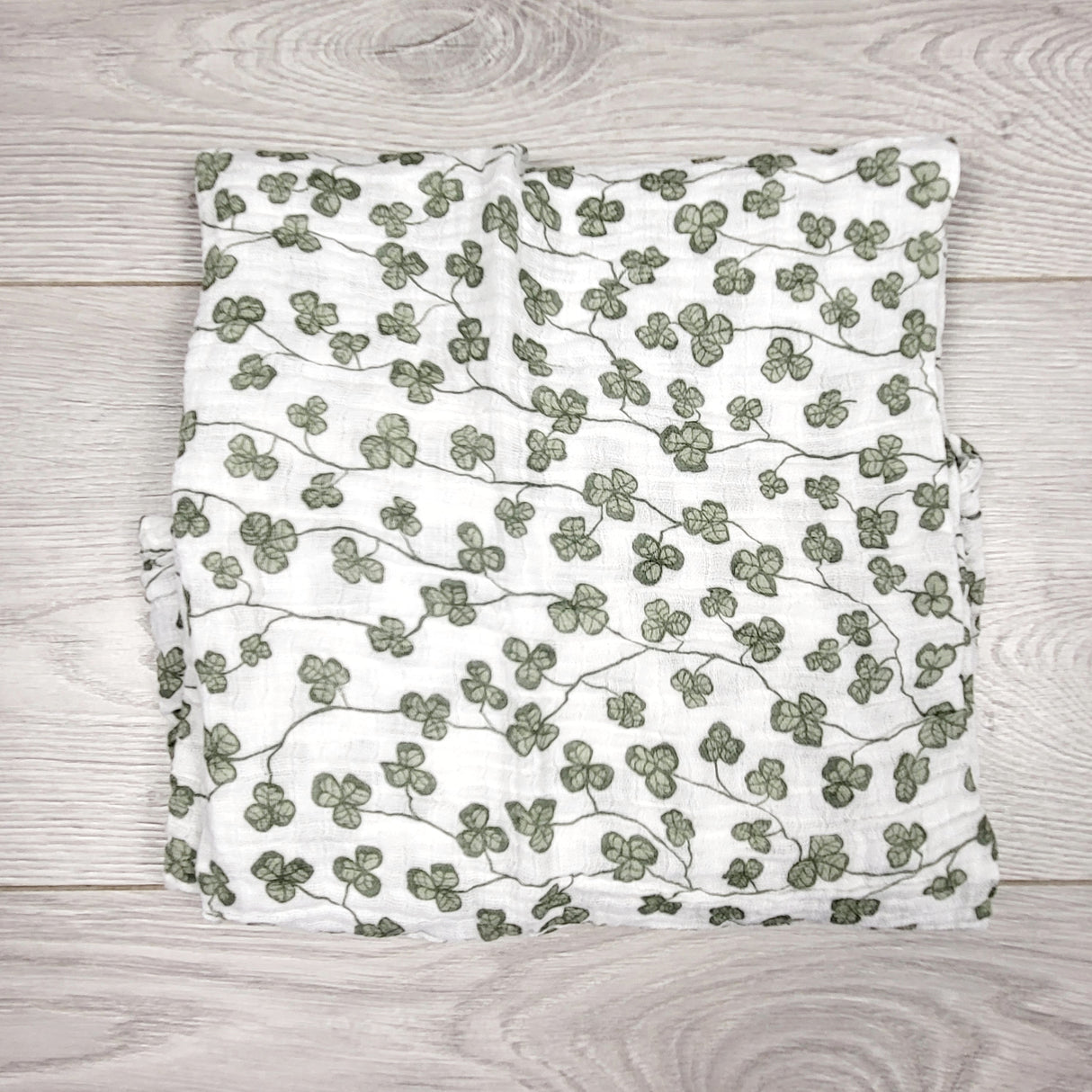 H and M muslin swaddle blanket with shamrocks