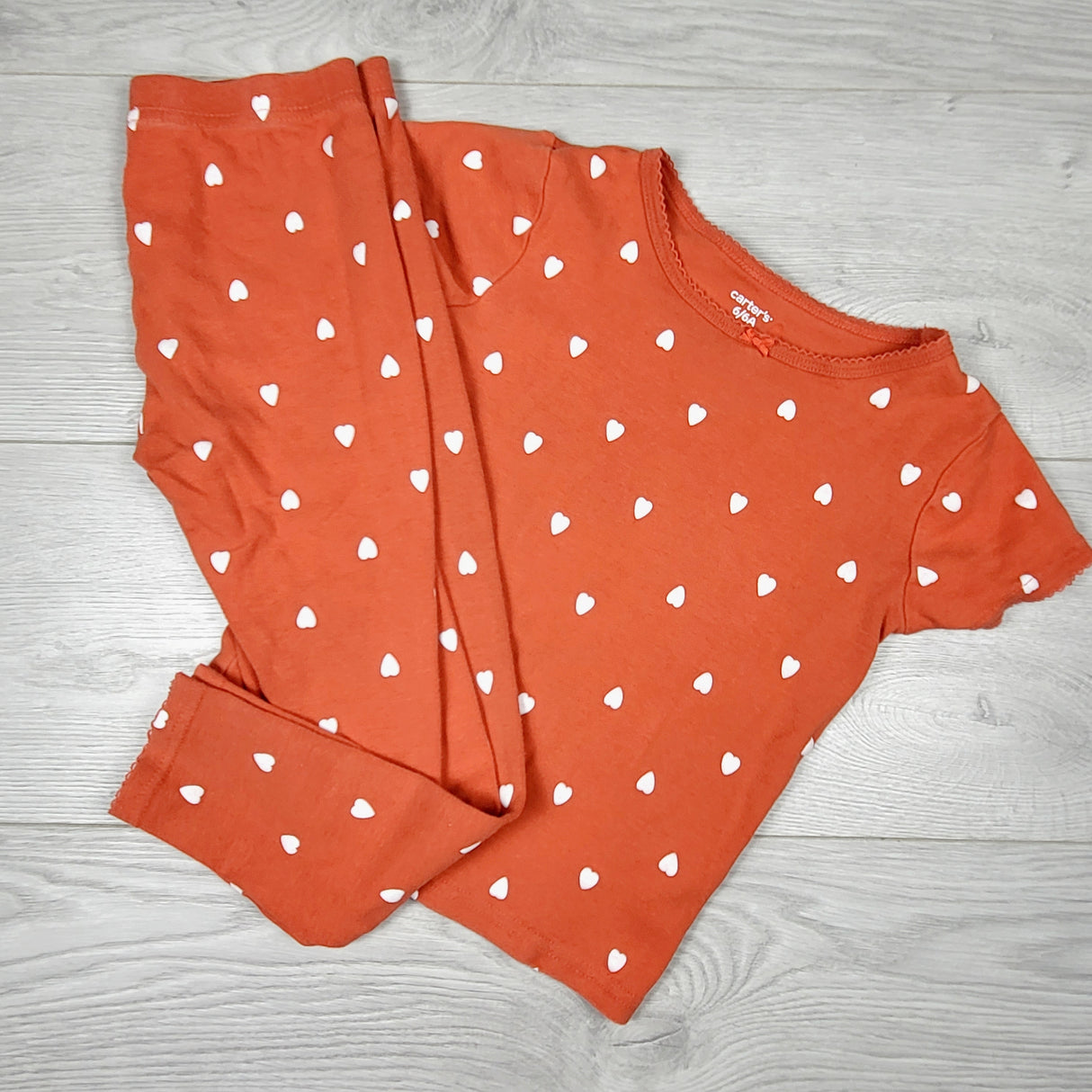 Carters red 2pc PJs with hearts. Size 6