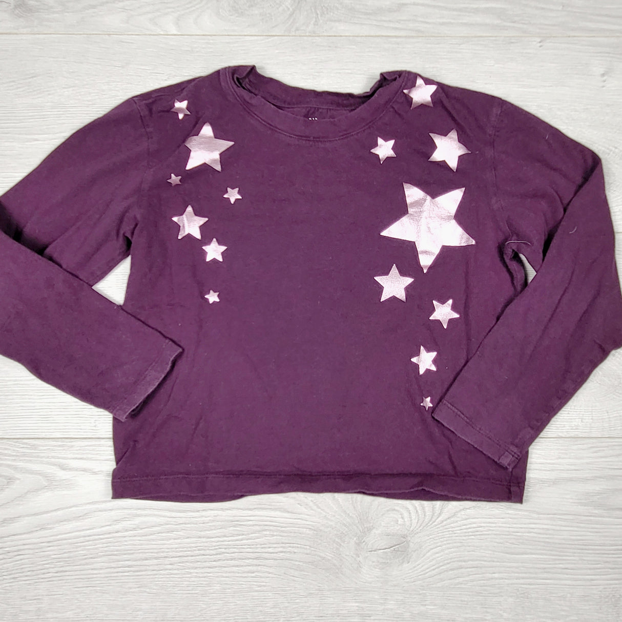 Gap purple top with stars. Size 6/7