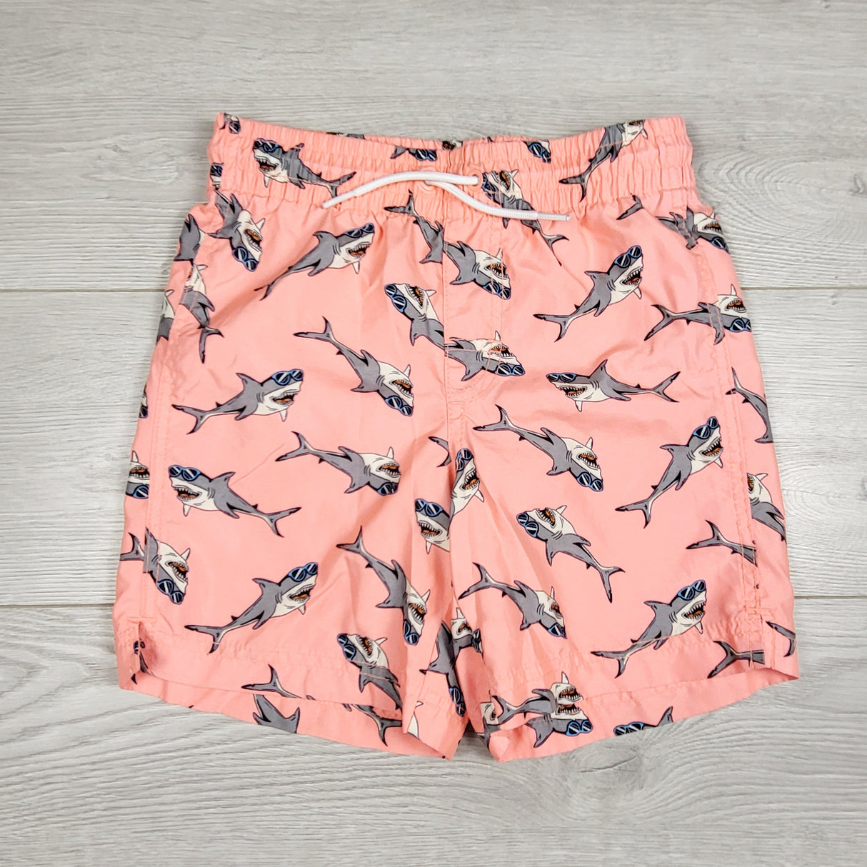 Old Navy pink swim shorts with sharks. Size 8