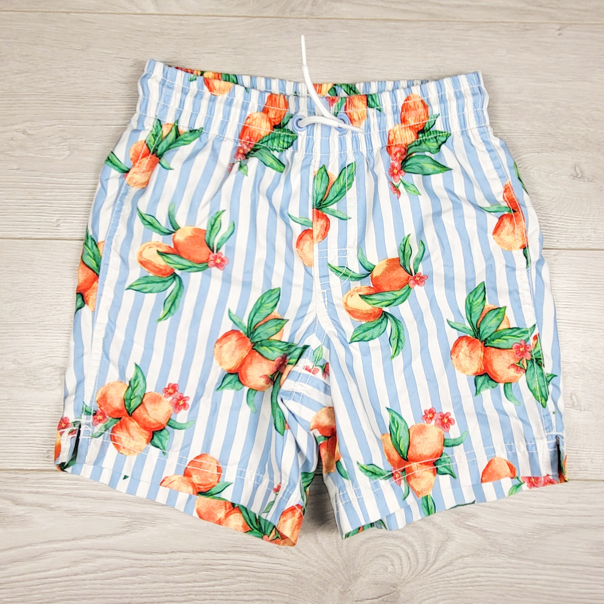 Old Navy blue striped swim shorts with oranges. size 8
