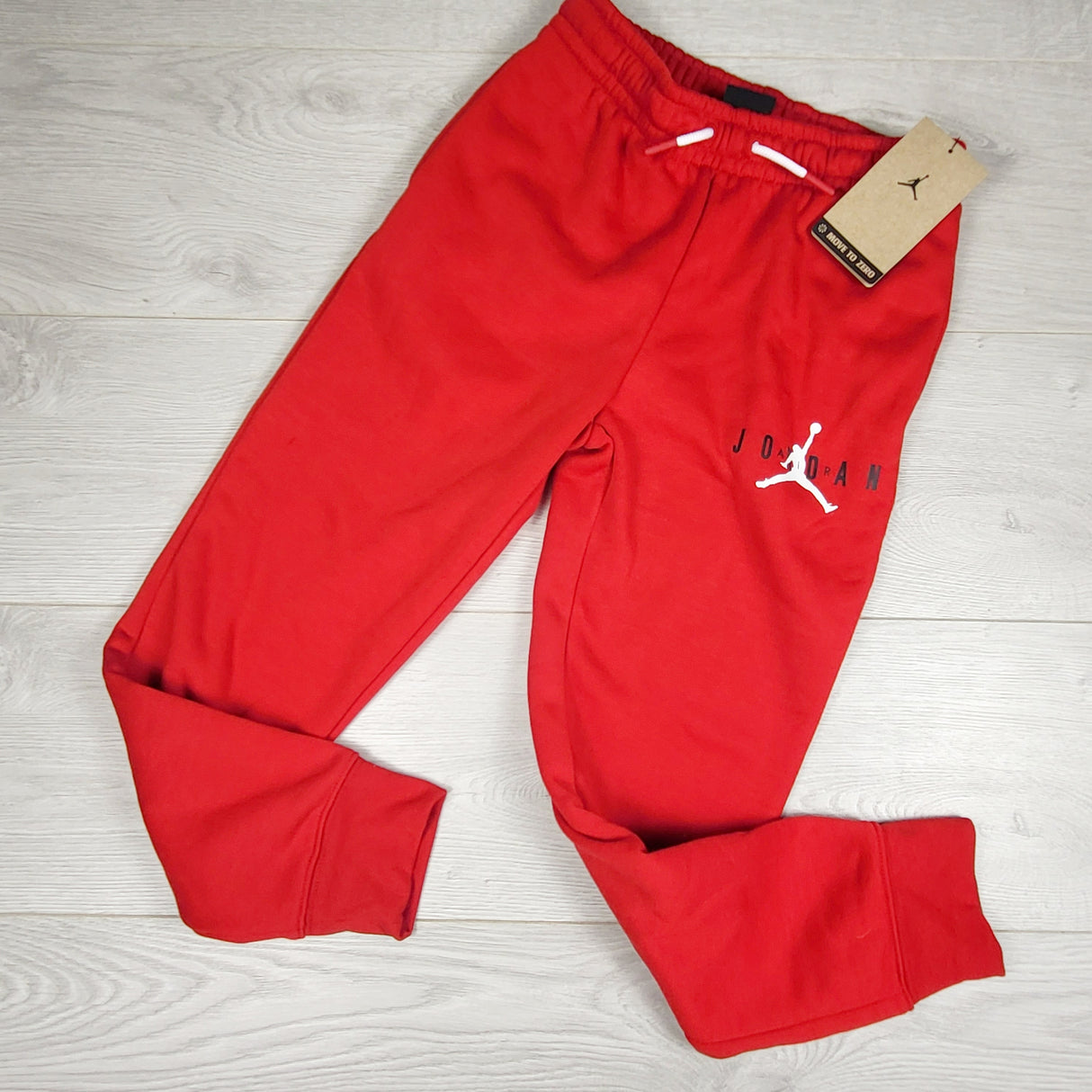 NEW - Air Jordam red fleecy lined joggers. Size 8-10 Years - AS IS