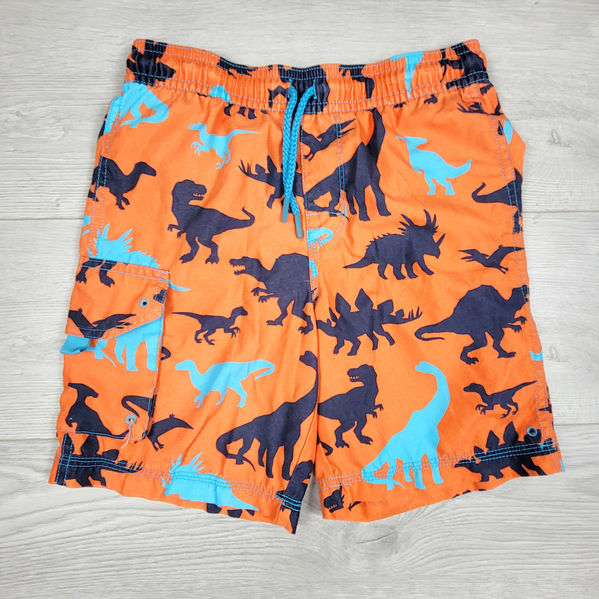Hatley orange swim shorts with dinosaurs. Size 7