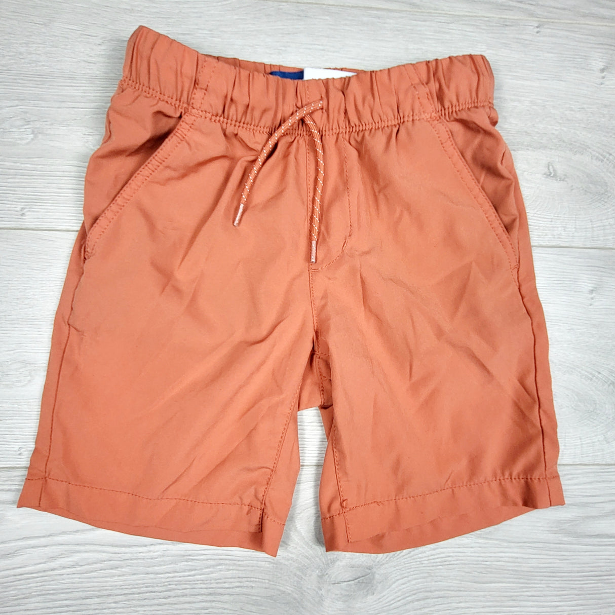 Old Navy orange quick dry shorts. Size 8