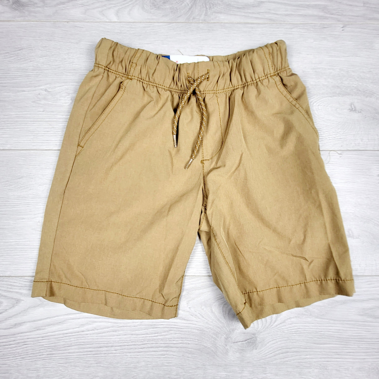 Old Navy tan quick dry drawstring shorts. Size 8
