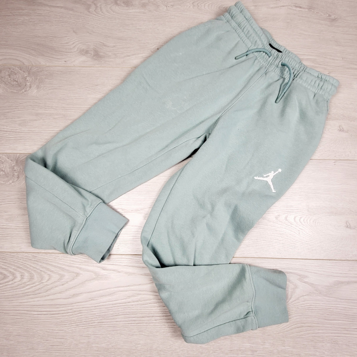 Air Jordan aqua coloured fleece lined drawstring joggers. Size 8-10 Years