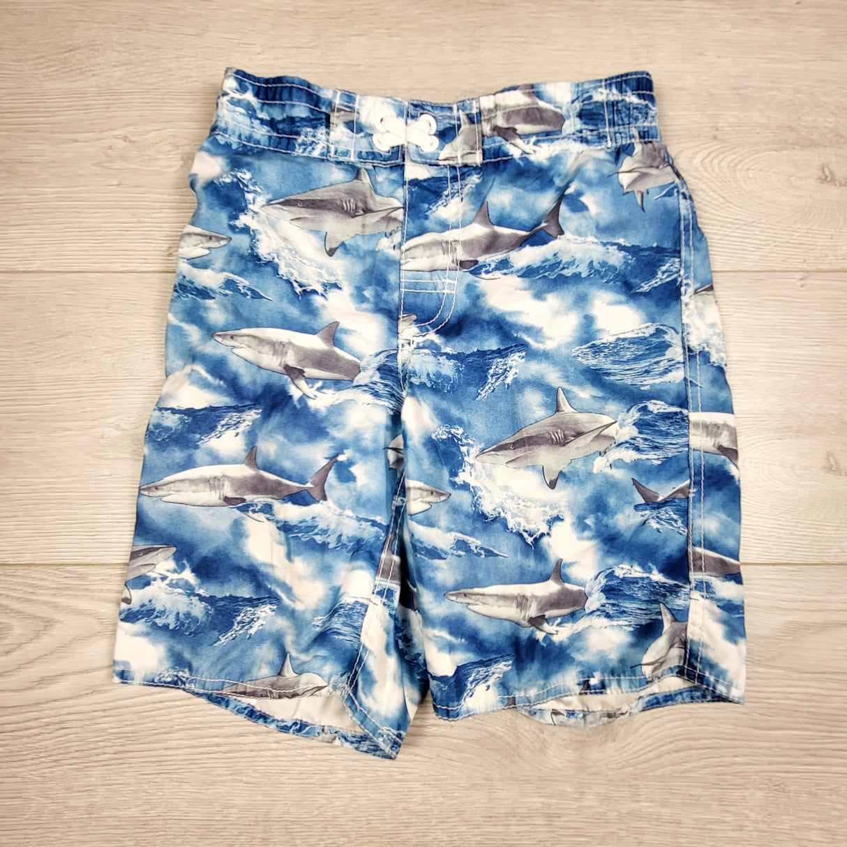 Old Navy blue swim shorts with sharks. Size 8