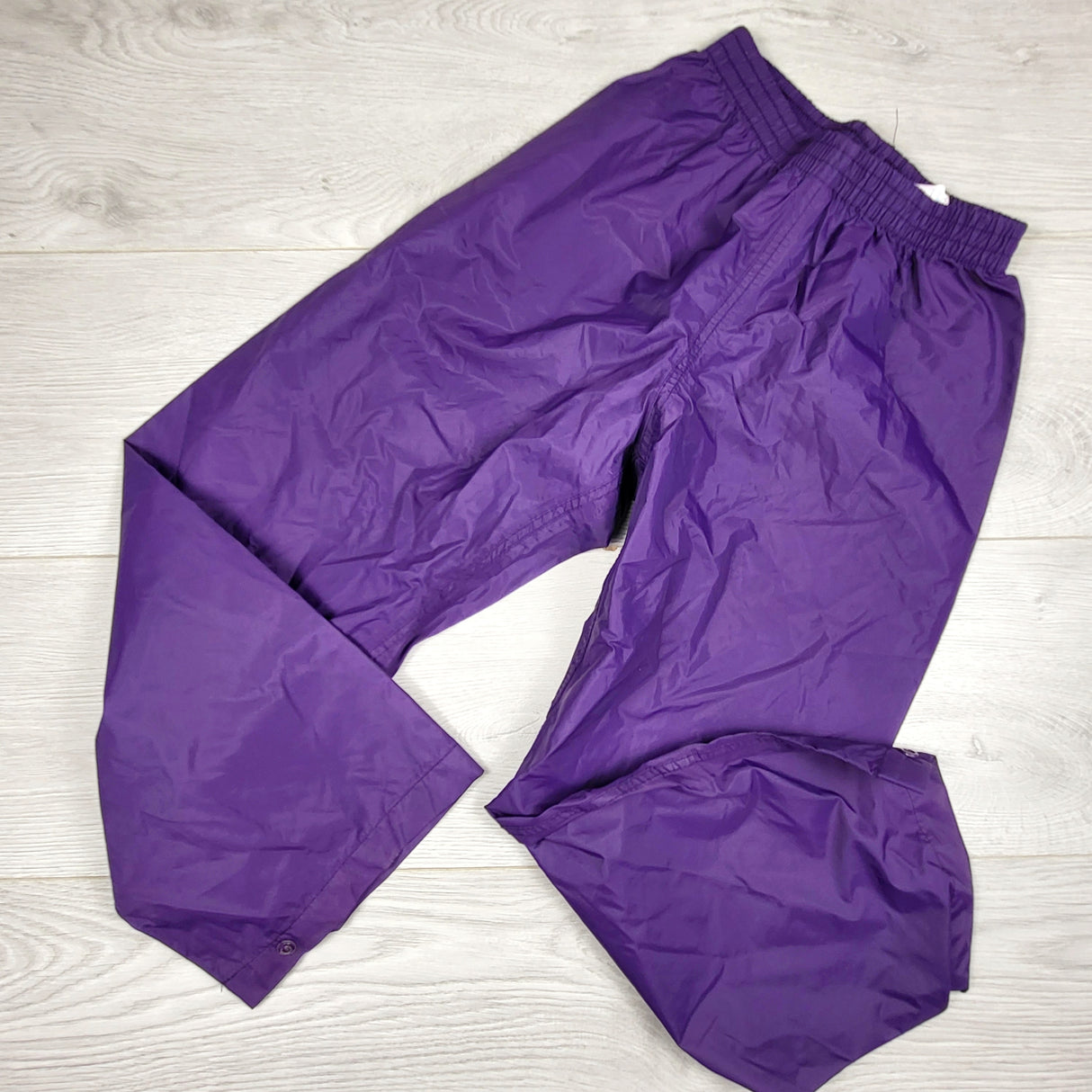 Mountain Warehouse purple single layer rain pants. Size 7/8
