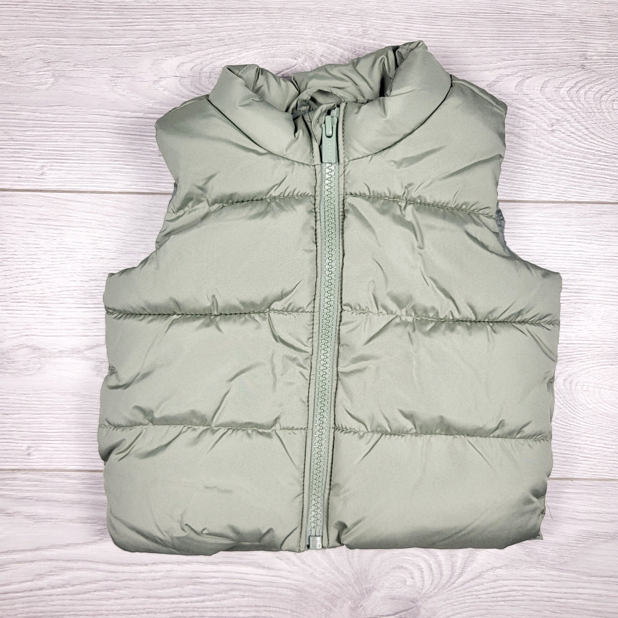 Old Navy sage green water resistant puffer vest. Size 3-6 months