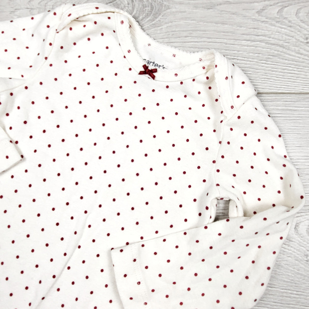 Carters cream coloured polka dot bodysuit. Size 12 months