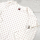 Carters cream coloured polka dot bodysuit. Size 12 months