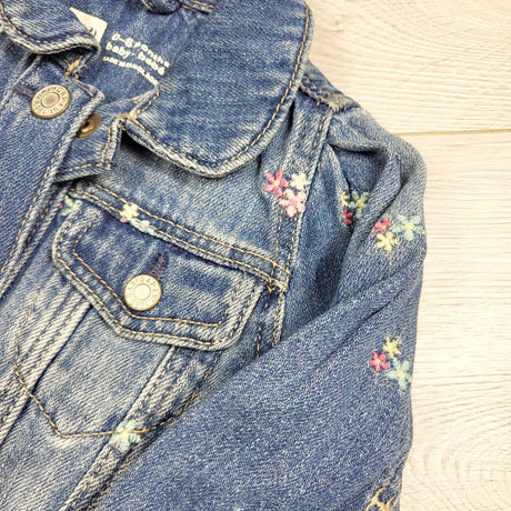 Gap distressed jean jacket with floral embroidery. Size 0-6 months