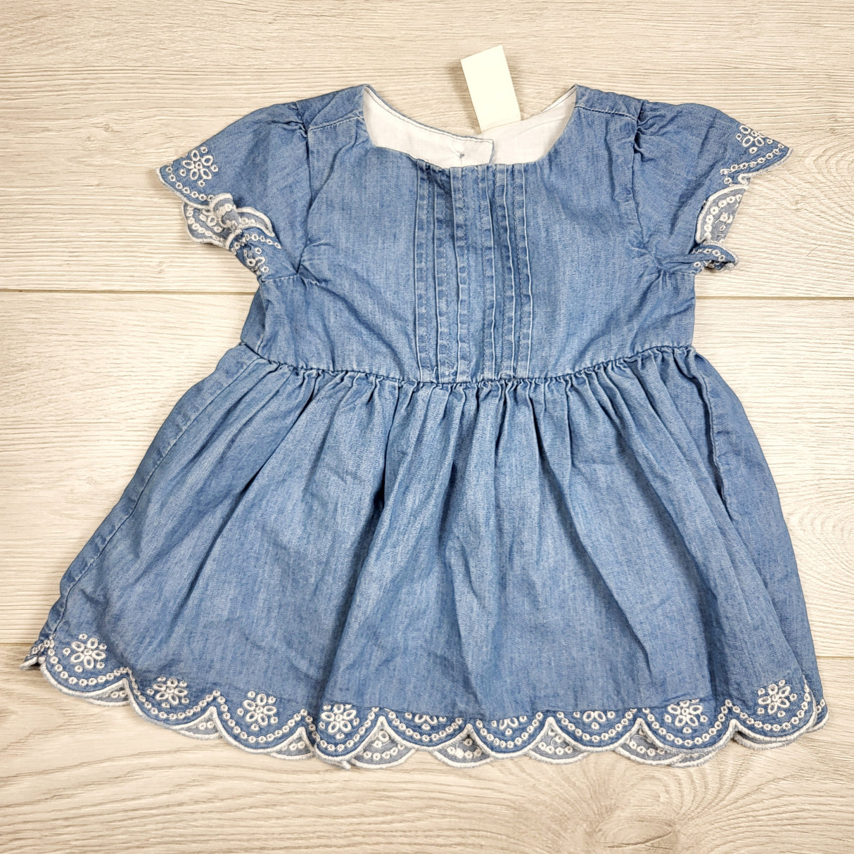 Baby B'gosh denim look dress with eyelet detail. Size 6 months