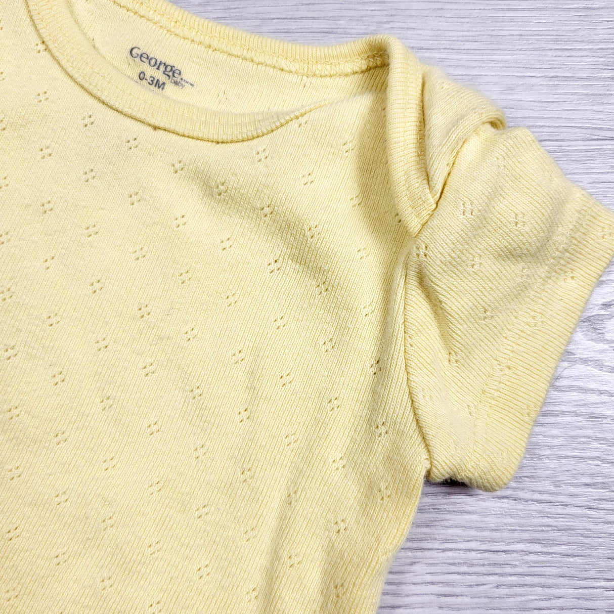 George yellow eyelet bodysuit. Size 0-3 months